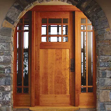 Rustic side lites complete the Craftsman style entry and all wood door