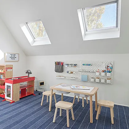 Remodeled upstairs family room is filled with natural light from two VELUX Skylights