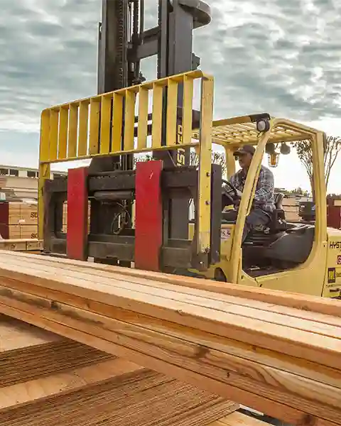 Forklift driver assembles 2x6 framing lumber and sheathing plywood for a delivery at our South San Francisco lumber yard
