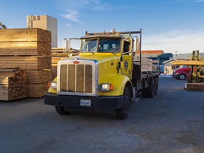 Early morning lumber delivery leaving the lumber yard